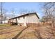 View of the back exterior of the home featuring a deck and well-kept yard, perfect for outdoor enjoyment at 1302 Hickory Nut Ln, Lincolnton, NC 28092