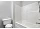 Bathroom with bathtub and toilet featuring clean, neutral color palette and functional design at 1302 Hickory Nut Ln, Lincolnton, NC 28092