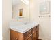 This bathroom features a vanity with sink, medicine cabinet and vanity mirror with towel rack at 1302 Hickory Nut Ln, Lincolnton, NC 28092