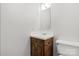 This bathroom features a vanity with sink, medicine cabinet, and a toilet at 1302 Hickory Nut Ln, Lincolnton, NC 28092