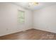 Cozy bedroom features bright neutral paint, and natural lighting at 1302 Hickory Nut Ln, Lincolnton, NC 28092