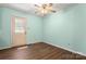 Bright empty room with vinyl flooring and natural light from window at 1302 Hickory Nut Ln, Lincolnton, NC 28092