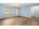 Hardwood flooring and ample natural light complement the versatility of the open living space at 1302 Hickory Nut Ln, Lincolnton, NC 28092