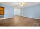 Expansive area with hardwood flooring, ideal for creating a warm and inviting living space at 1302 Hickory Nut Ln, Lincolnton, NC 28092