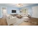 Bright living room featuring stylish furnishings, creating a cozy and inviting atmosphere at 1302 Hickory Nut Ln, Lincolnton, NC 28092