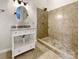 Modern bathroom with tiled shower and vanity with granite countertop at 7210 Morningdew Ct, Denver, NC 28037