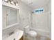 Clean bathroom featuring a shower-tub combo, and modern fixtures at 7210 Morningdew Ct, Denver, NC 28037