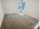Neutral bedroom featuring natural light and carpet at 7210 Morningdew Ct, Denver, NC 28037