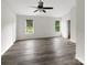 Bright bedroom with ample space, neutral paint, hardwood floors, and natural light at 7210 Morningdew Ct, Denver, NC 28037