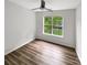 Clean bedroom featuring natural light and wood flooring at 7210 Morningdew Ct, Denver, NC 28037