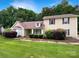 Charming home featuring a landscaped yard, neutral siding, and classic architectural details at 7210 Morningdew Ct, Denver, NC 28037