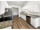 Well-lit kitchen featuring stainless steel appliances, ample counter space, and sleek cabinetry at 7210 Morningdew Ct, Denver, NC 28037