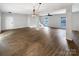 Spacious living room with hardwood floors, modern lighting and neutral paint at 7210 Morningdew Ct, Denver, NC 28037