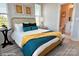 Charming bedroom with a cane headboard and en-suite bathroom at 1013 North End Dr # 26, Charlotte, NC 28206