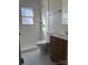 Updated bathroom with white tile, a shower, and a vanity at 3918 Barlowe Rd, Charlotte, NC 28208