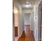 Bright hallway with hardwood floors leading to bedrooms and bathroom at 3918 Barlowe Rd, Charlotte, NC 28208