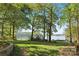 Picturesque backyard view with a lush green lawn at 501 Nivens Cove Rd, Mount Holly, NC 28120
