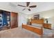 Bedroom with a ceiling fan and a closet, adjacent to a partially visible bathroom at 501 Nivens Cove Rd, Mount Holly, NC 28120