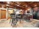 Dining area with a bar and coffered wood ceiling, and bar stool seating at 501 Nivens Cove Rd, Mount Holly, NC 28120