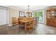 Dining room features wood table with seating for eight, light fixture, and access to the deck at 501 Nivens Cove Rd, Mount Holly, NC 28120