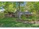 Stunning home featuring stone accents, a charming balcony, and lush greenery at 501 Nivens Cove Rd, Mount Holly, NC 28120