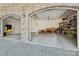 Spacious three-car garage with stone archways and ample storage space at 501 Nivens Cove Rd, Mount Holly, NC 28120