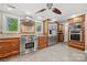 Gourmet kitchen with stainless steel appliances, custom cabinets, large island, and tile flooring at 501 Nivens Cove Rd, Mount Holly, NC 28120