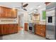 Spacious kitchen features wood cabinets, stainless steel appliances, granite counters, and tile backsplash at 501 Nivens Cove Rd, Mount Holly, NC 28120