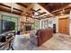 Inviting living room with a stone fireplace and wood-beam ceilings, adding rustic charm at 501 Nivens Cove Rd, Mount Holly, NC 28120