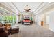 Spacious main bedroom with tray ceiling, ceiling fan, and access to the outdoor deck at 501 Nivens Cove Rd, Mount Holly, NC 28120