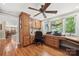 Home office with custom built-in cabinets, desk, and natural light from the window at 501 Nivens Cove Rd, Mount Holly, NC 28120