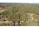 Aerial view of property showcasing expansive land and wooded area at 3220 Sawmill Rd, Hickory Grove, SC 29717