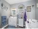 Main bathroom with soaking tub, vanity, and updated fixtures at 3220 Sawmill Rd, Hickory Grove, SC 29717