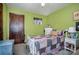 Cozy bedroom with a white bed frame and patterned quilt at 3220 Sawmill Rd, Hickory Grove, SC 29717