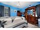 Blue bedroom with a wooden bed frame and star quilt at 3220 Sawmill Rd, Hickory Grove, SC 29717