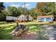 House exterior with a deck, detached garage, and landscaped yard at 3220 Sawmill Rd, Hickory Grove, SC 29717