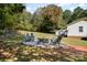 Relaxing fire pit area with chairs in backyard at 3220 Sawmill Rd, Hickory Grove, SC 29717