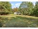 Single-story home with large green yard and trees at 3220 Sawmill Rd, Hickory Grove, SC 29717