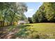 House with a large green backyard and trees at 3220 Sawmill Rd, Hickory Grove, SC 29717