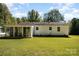 White house with sunroom and spacious backyard at 3220 Sawmill Rd, Hickory Grove, SC 29717