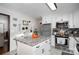 View of kitchen island, stainless steel appliances, and white cabinets at 3220 Sawmill Rd, Hickory Grove, SC 29717