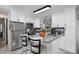 Kitchen boasts an island with granite countertops and white cabinetry at 3220 Sawmill Rd, Hickory Grove, SC 29717