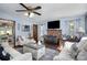 Cozy living room features a brick fireplace, and plenty of natural light at 3220 Sawmill Rd, Hickory Grove, SC 29717