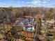 Aerial view of a waterfront home with pool and surrounding landscape at 19819 Stough Farm Rd, Cornelius, NC 28031