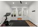 Home gym with Peloton bike and yoga mat at 19819 Stough Farm Rd, Cornelius, NC 28031