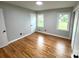 Bright bedroom with hardwood floors, neutral walls, and plenty of natural light at 612 Brown Ave, Albemarle, NC 28001