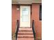 Close-up of a well-lit front door with brick steps, adding to the home's curb appeal at 612 Brown Ave, Albemarle, NC 28001