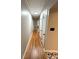 Hallway with hardwood floors and white trim, illuminated by a modern ceiling light at 612 Brown Ave, Albemarle, NC 28001