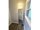 This hallway features a tall mirror, hardwood floors, and a view to the outdoors at 612 Brown Ave, Albemarle, NC 28001