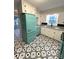 Charming kitchen featuring a retro-style refrigerator and black and white patterned flooring at 612 Brown Ave, Albemarle, NC 28001